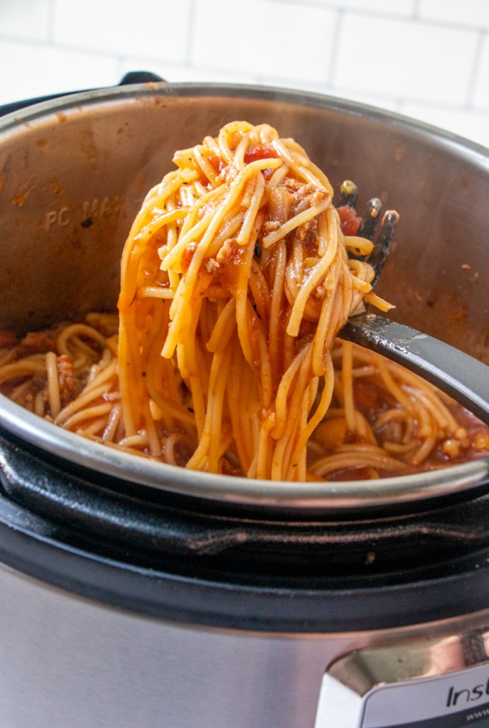 serving meat spaghetti with a pasta spoon from Instant Pot