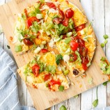 sliced Mexican pizza on a cutting board