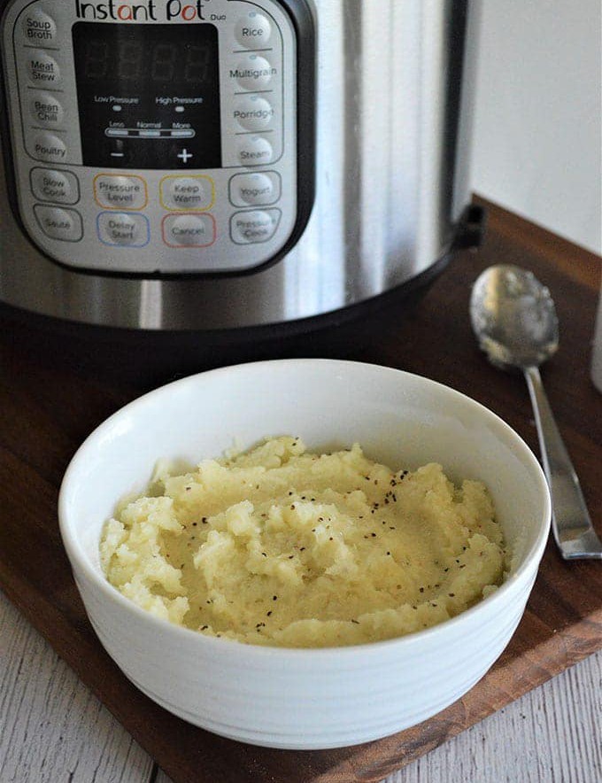 Instant Pot Mashed Cauliflower in a white bowl