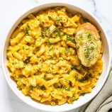 pressure cooker pumpkin macaroni and cheese in a white bowl