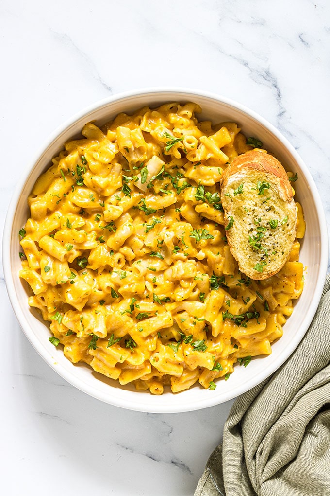 pressure cooker pumpkin macaroni and cheese in a white bowl