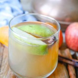 pressure cooker apple cider in a clear cup
