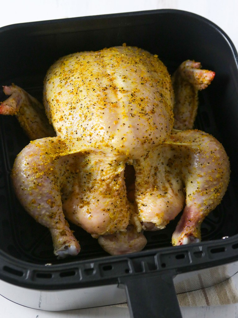 chicken seasoned with lemon pepper ready to cook in an air fryer